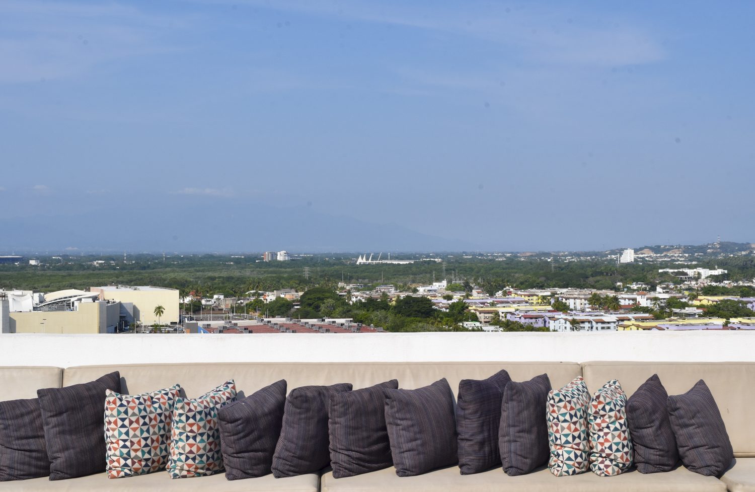 Panoramic city and mountain views from the Zoho Skies rooftop terrace